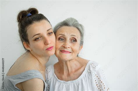 Happy Senior Mother Is Hugging Her Adult Daughter The Women Are