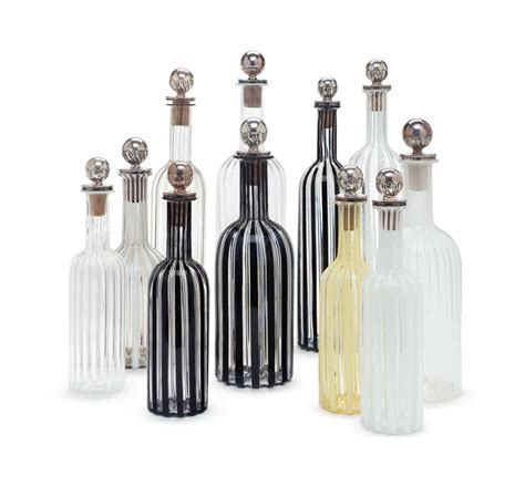 A Set Of Eleven Italian Silver Mounted Blown Glass Decanters And