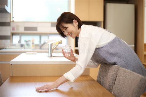 Woman Wiping The Table Stock Photo Image Of Landscape