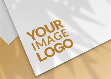 Logo Mockup On White Paper With Orange Background Mediamodifier