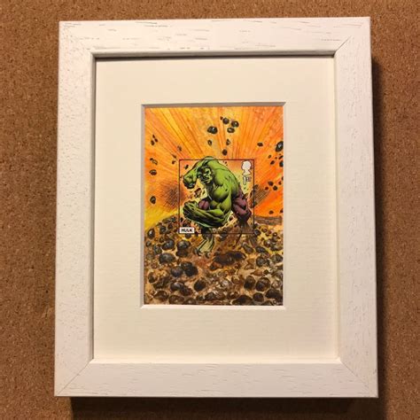 The Incredible Hulk Painting Is Displayed In A White Frame On A Brown