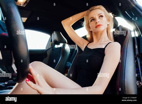 Blonde Behind The Wheel Of A Car Driver Travel Autolady Stock Photo Alamy