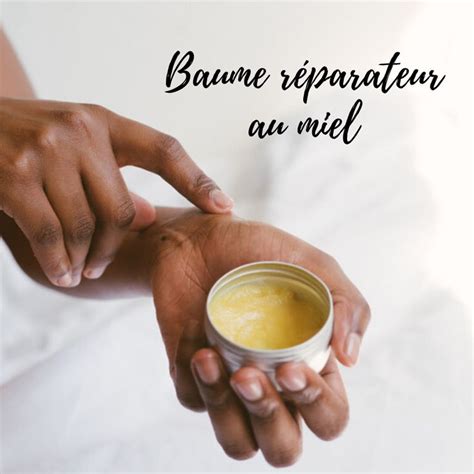 A Person Holding A Small Cup With Some Liquid In It And The Words Baume