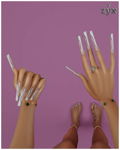 Two Female Hands With White Nails And Green Jeweled Rings On Their