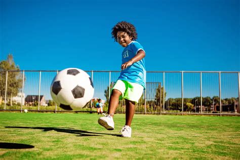 Asian Boy Kicking And Juggling A Soccer Ball By Stocksy Contributor