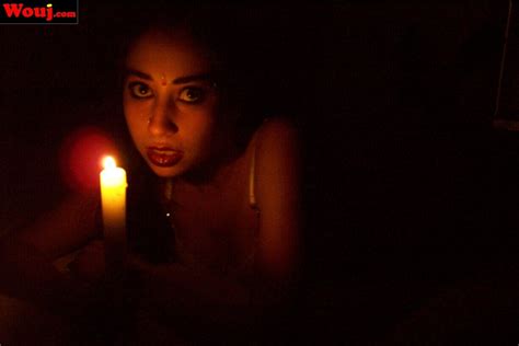 Sexy Redhead Babe Playing With A Lit Candle On The Bed Photos