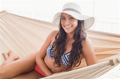 Premium Photo Pretty Brunette Relaxing On A Hammock