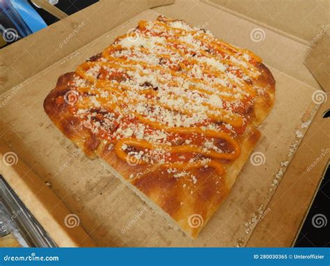 A Square Pizza Wedge Sliced On Display Ready For Serving Stock Image