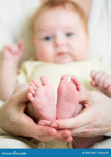 Mother Hands Holding Baby S Feet Stock Image Image Of Green