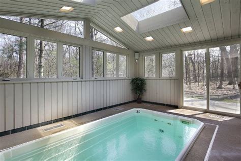 Indoor Swimming Pool In A Standalone Building With A Sliding Glass Door