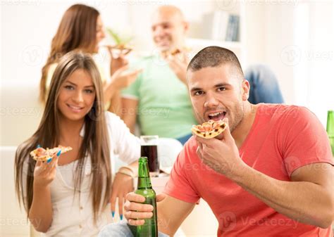 Friends eating pizza 14230675 Stock Photo at Vecteezy