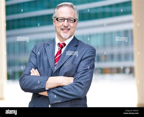 Mature Businessman Smiling Stock Photo Alamy