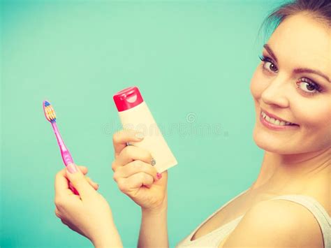 Woman Holds Toothbrush And Paste For Teeth Cleaning Stock Image Image