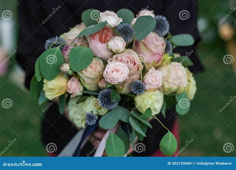 Woman S Hands Hold A Bouquet Flower Arrangement Consists Of Different