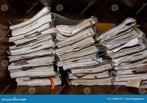 Old Paper Documents Stacked In Archive Documents On The Shelves Of