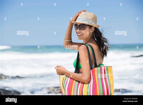 Beautiful woman smiling on the beach Stock Photo - Alamy