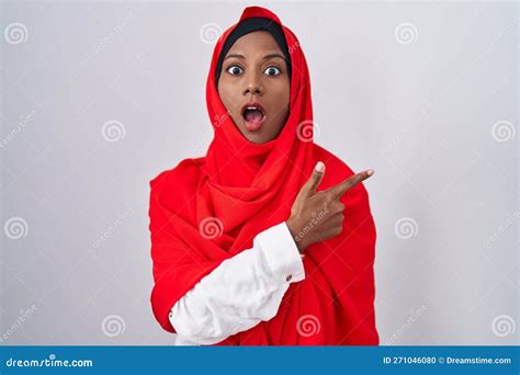 Young Arab Woman Wearing Traditional Islamic Hijab Scarf Surprised