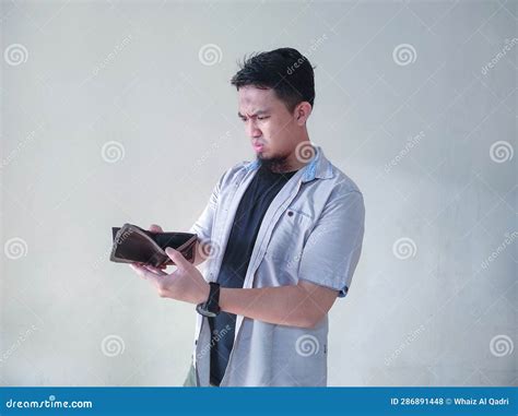 A Mature Asian Man Is Opening His Empty Wallet Stock Photo Image Of