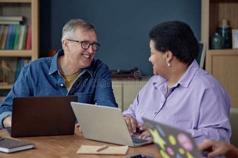 Smiling Mature Man Talking To Woman Using Computer Stock Image Image