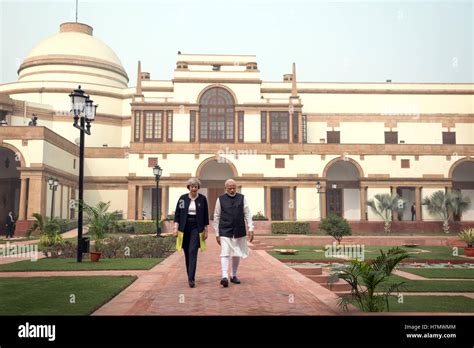 Prime Minister Theresa May and Indian Prime Minister Narendra Modi walk ...