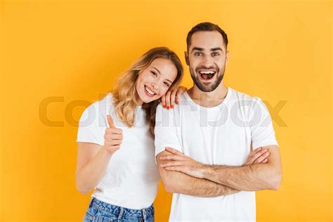 Excited Cheerful Young Couple Standing Isolated Stock Image Colourbox