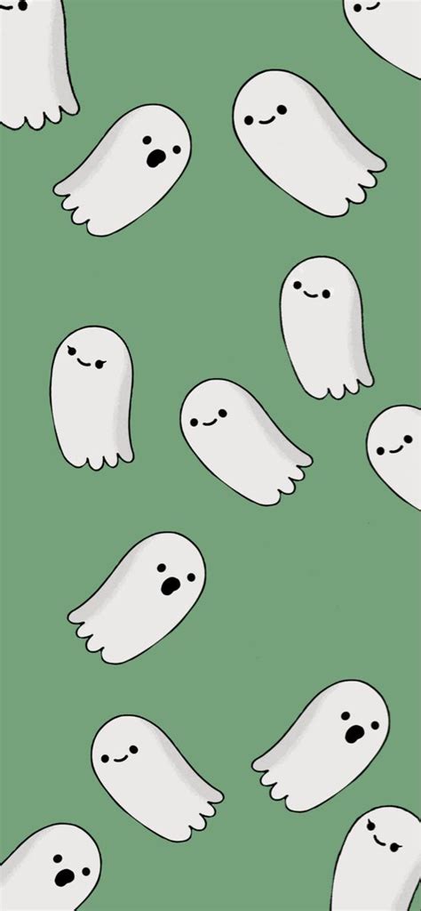 A Group Of White Ghost Faces On A Green Background