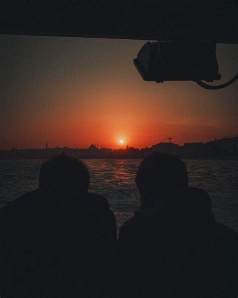 Silhouette of Two People during Sunset · Free Stock Photo