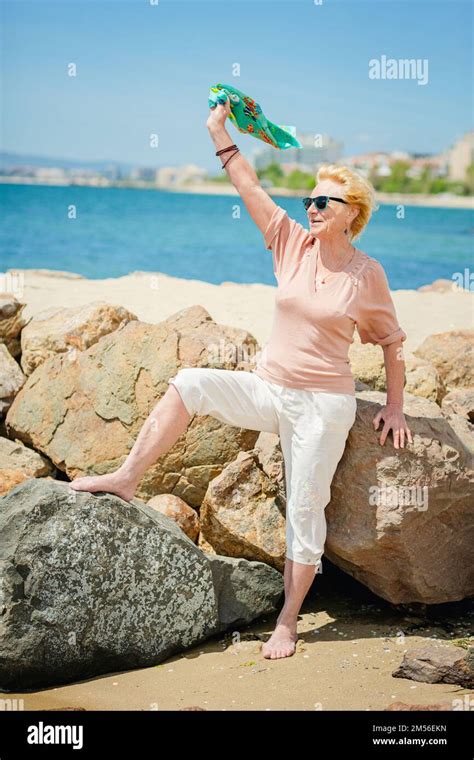 Happy Mature Woman Smiling And Having Fun At Beach Stock Photo Alamy