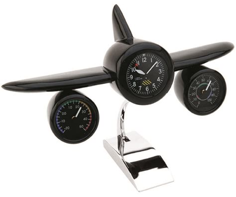 An Airplane Clock With Two Gauges Attached To It S Sides And The Time On Each Side