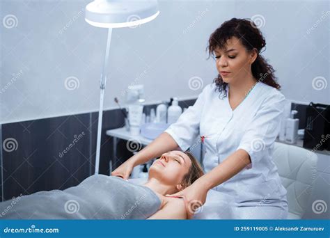 Attractive Female At Spa Health Club Getting A Facial Massage