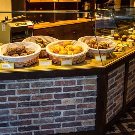 A Display Case Filled With Lots Of Different Types Of Pastries In