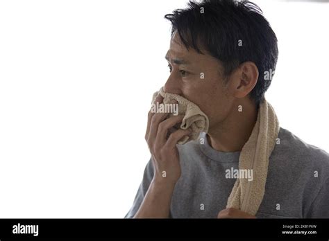 Japanese Man Wiping His Mouth With A Towel Stock Photo Alamy