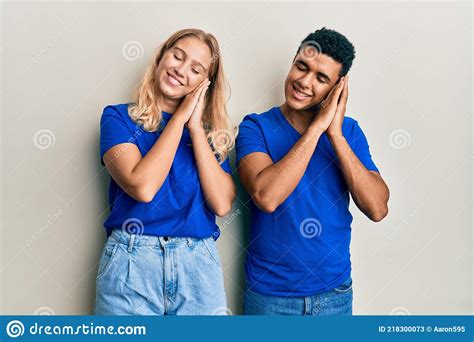 Young Interracial Couple Wearing Casual Clothes Sleeping Tired Dreaming