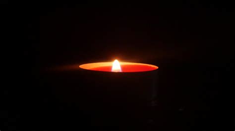 Candle flame burning close up 20390589 Stock Video at Vecteezy