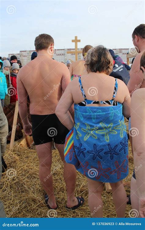 Orthodox Holiday Baptism In Russia A Crowd Of Naked People Plunge Into The Icy Water In Winter