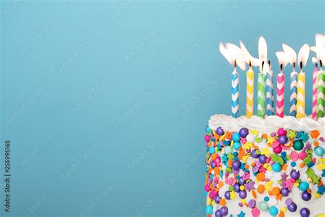 Colorful birthday cake with lots of candles Stock Photo | Adobe Stock