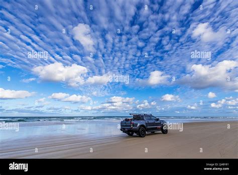 A 4wd Dual Cab Ute Driving Along 75 Mile Beach On Fraser Island