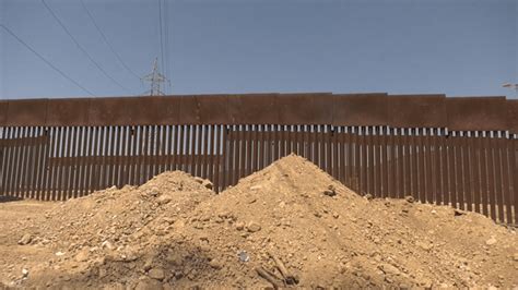 Tijuana launches program to urge migrants not to scale border barrier