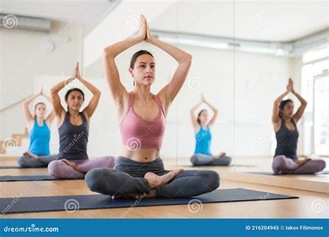 Young Woman Practicing Yoga Meditation In Lotus Positions Stock Image