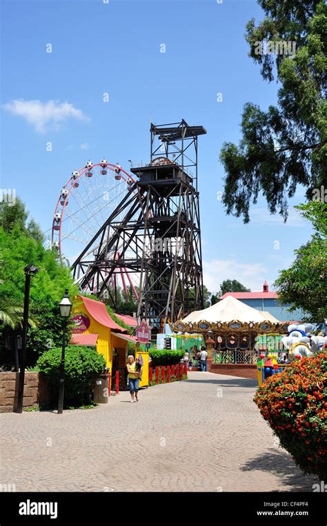 Coal winding gear and children's rides at Gold Reef City Theme Park ...