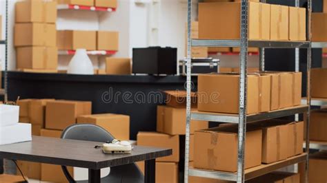 Empty Storage Room Filled With Many Cardboard Boxes On Racks Stock