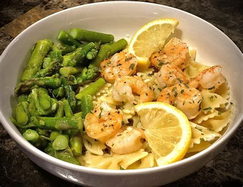 Homemade Garlic Butter Shrimp Over Bow Tie Pasta With A Side Of Asparagus Rseafood