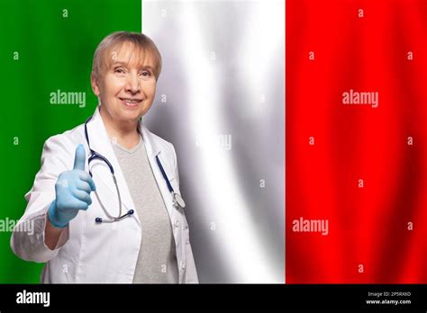 Italian Smiling Mature Doctor Woman Holding Stethoscope On Flag Of
