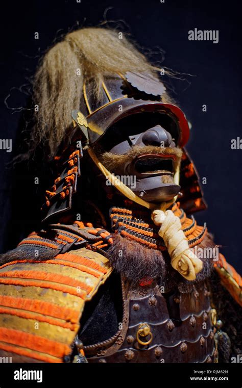 Ancient Japanese Samurai Armour Suit On Black Background Stock Photo