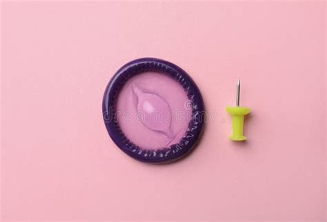 Purple Condom And Birth Control Pills In Pocket Of Jeans Safe Sex