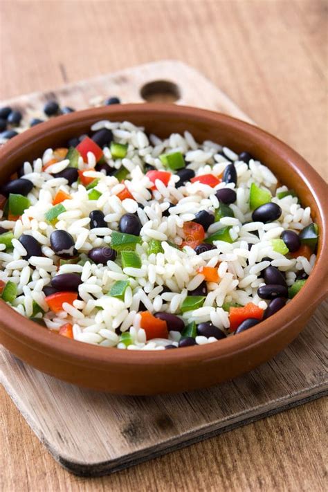 Traditional Cuban Rice Black Beans And Pepper On Wood Moros Y