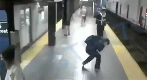 Horrifying Moment Woman Shoved Into Path Of Oncoming Train But