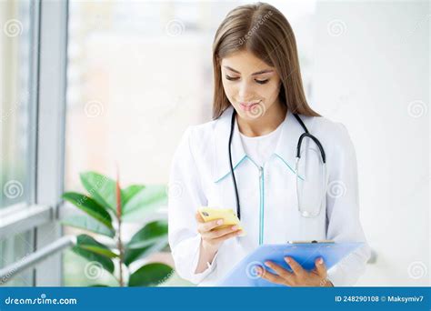 Medical Beautiful Female Doctor In White Coat With Stethoscope Stock