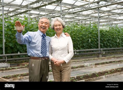 Senior couple in modern farm Stock Photo - Alamy