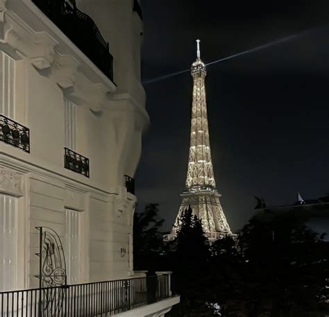 The Eiffel Tower Is Lit Up At Night